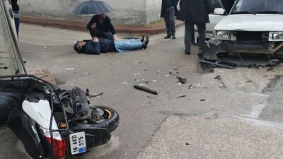 Bursa’da kaza yapan sürücünün başında şemsiyeyle bekledi